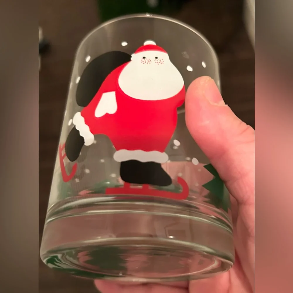 8 Crate & Barrel vintage skating Santa lowball glasses. 12oz